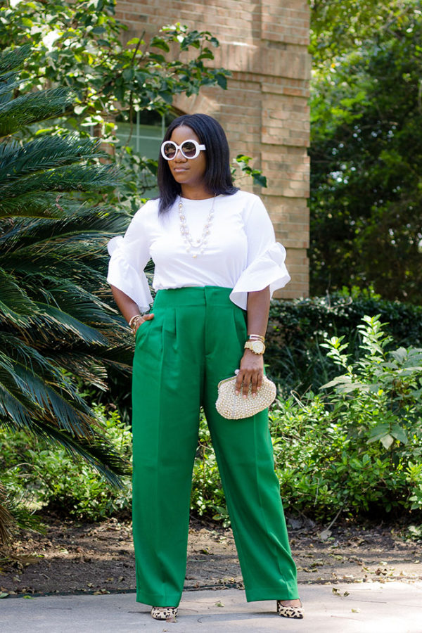 green top white pants